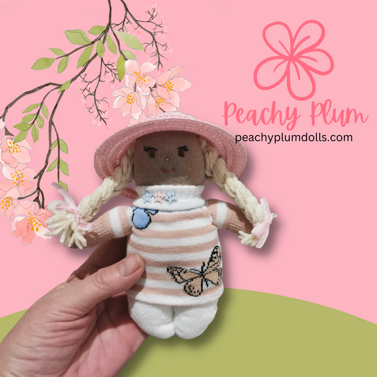 Sock Dolly with a straw hat